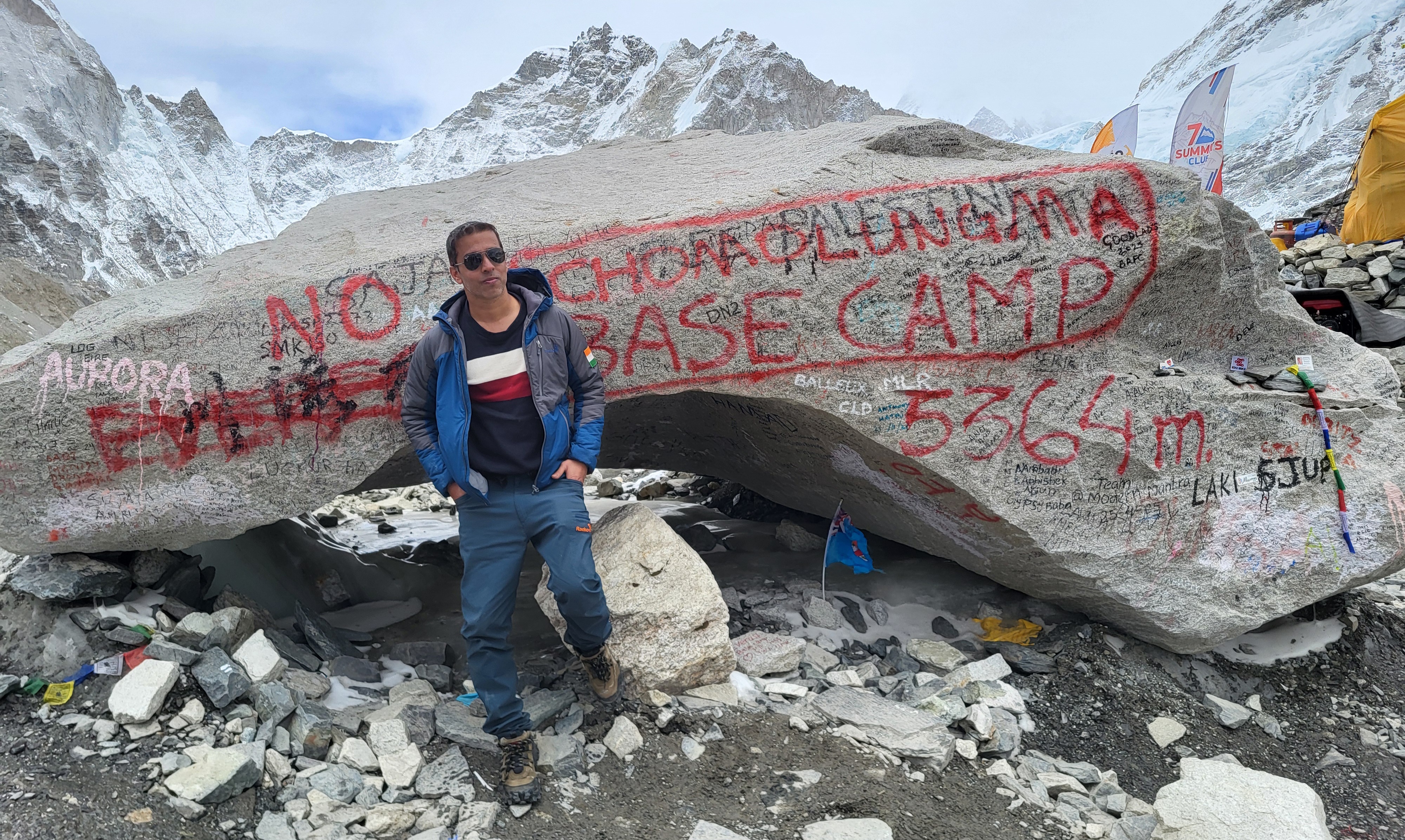 Standing at the Everest Base Camp rock marker, 5,364m