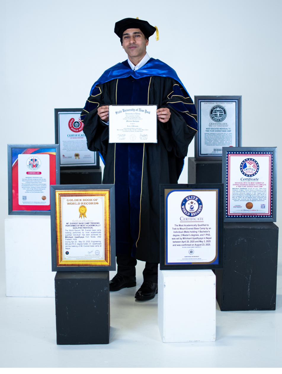 In doctoral robes with world record certificates and degrees